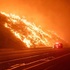 The Palisades fire raging beside a road